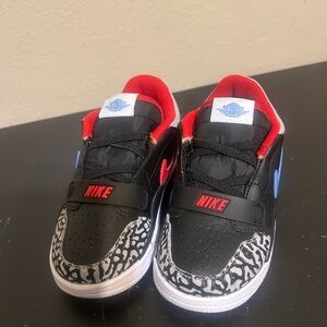 Nike Kids Black, Red, and Blue Sneakers